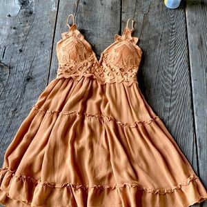 Dress, padded, Size XS. On the orange side of tan color.